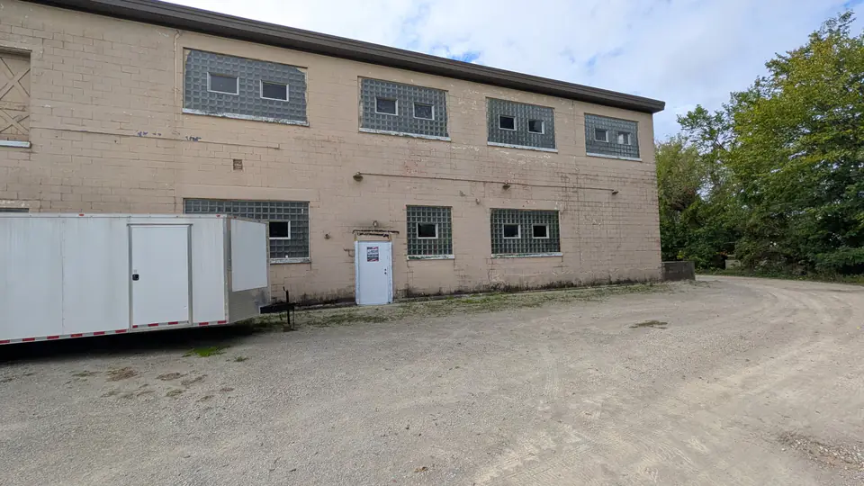 Exterior of the brick building housing Dairyland Forklifts in Lake Mills