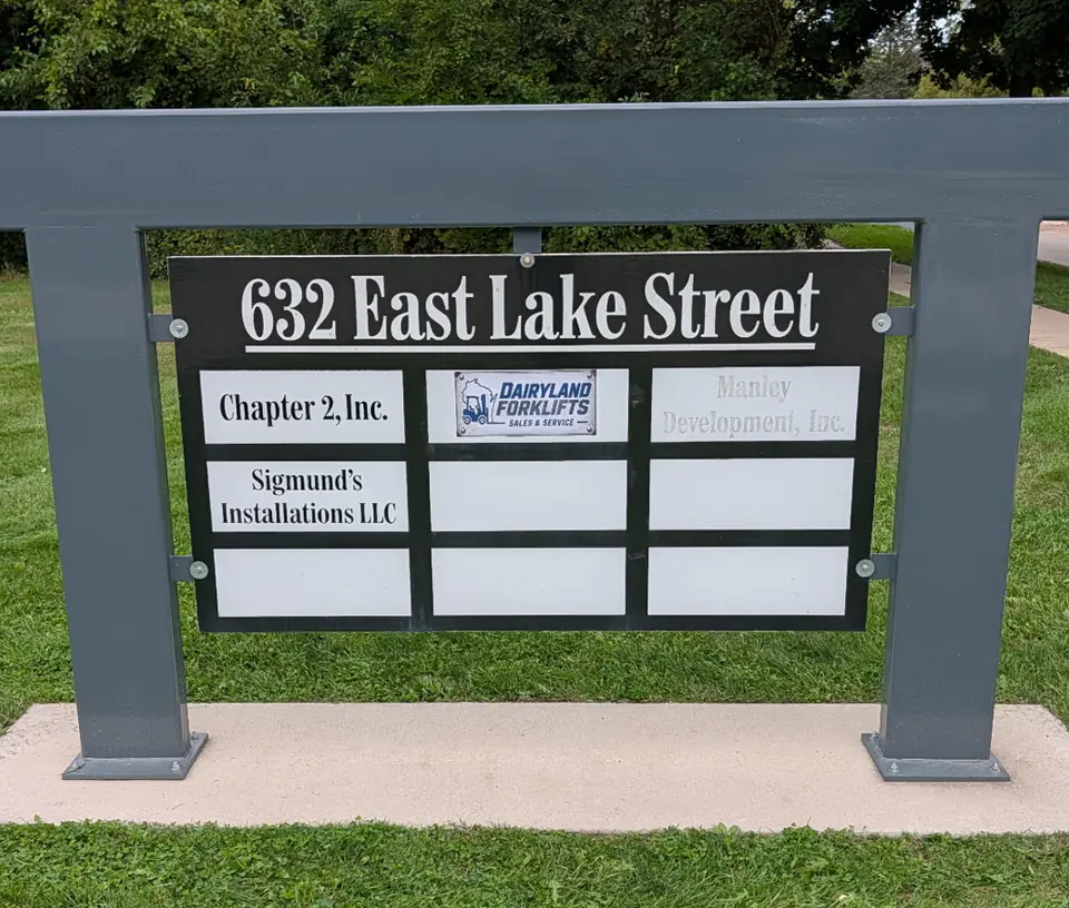 632 East Lake Street roadside sign with a Dairyland Forklifts panel